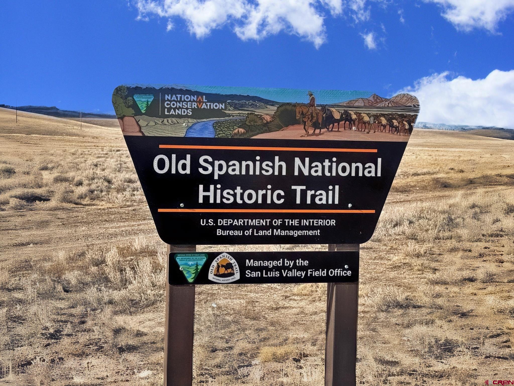 0 Blm Road Monte Vista, CO 81144 - Photo 5 of 9 a sign on the wall next to a building
