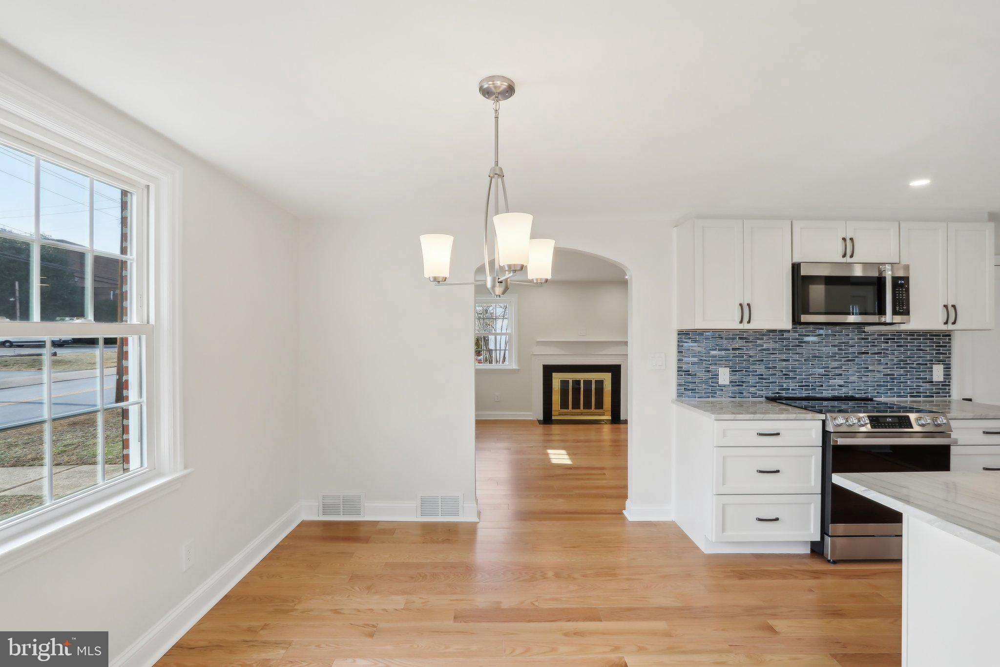 607 Fairview Road Swarthmore, PA 19081 - Photo 13 of 63 a kitchen with stainless steel appliances granite countertop a stove and cabinets