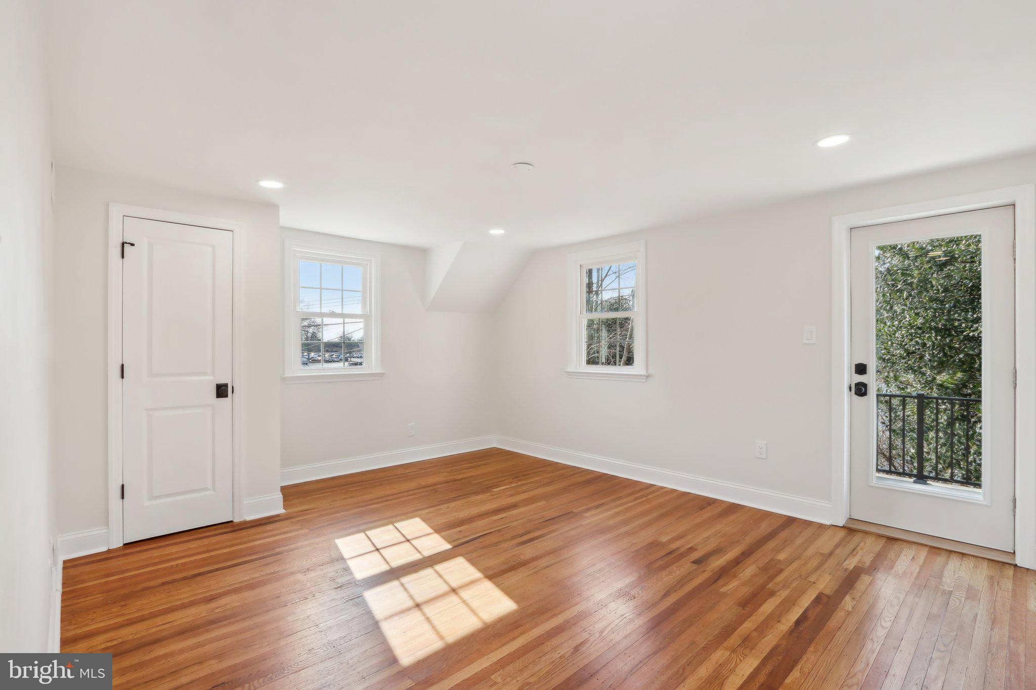 607 Fairview Road Swarthmore, PA 19081 - Photo 37 of 63 wooden floor in an empty room with a window