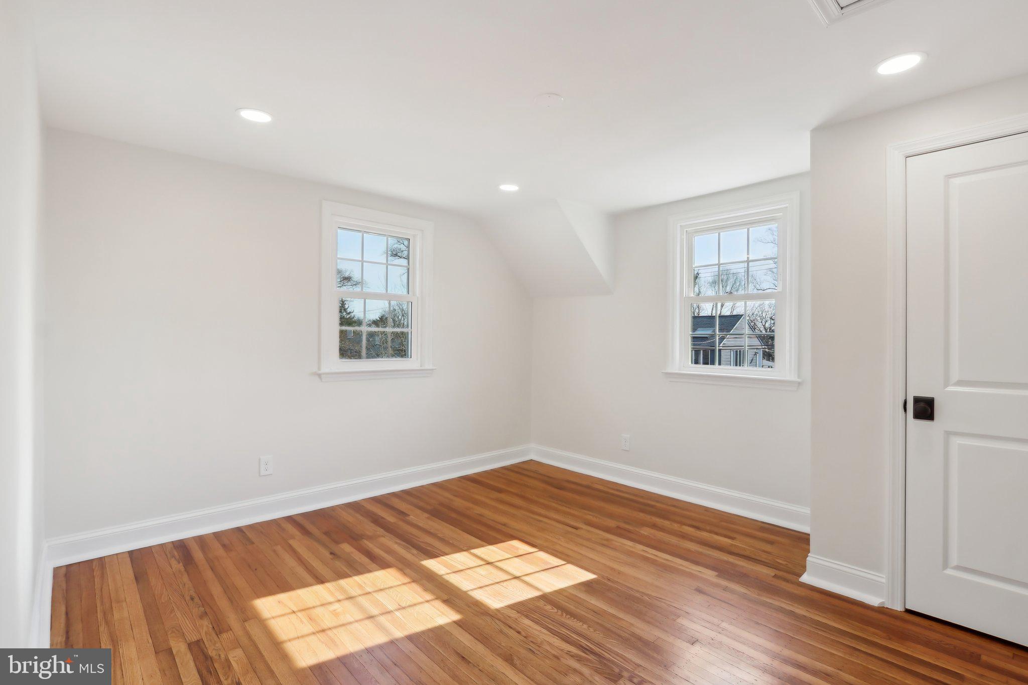 607 Fairview Road Swarthmore, PA 19081 - Photo 48 of 63 a view of a room with wooden floor and white walls