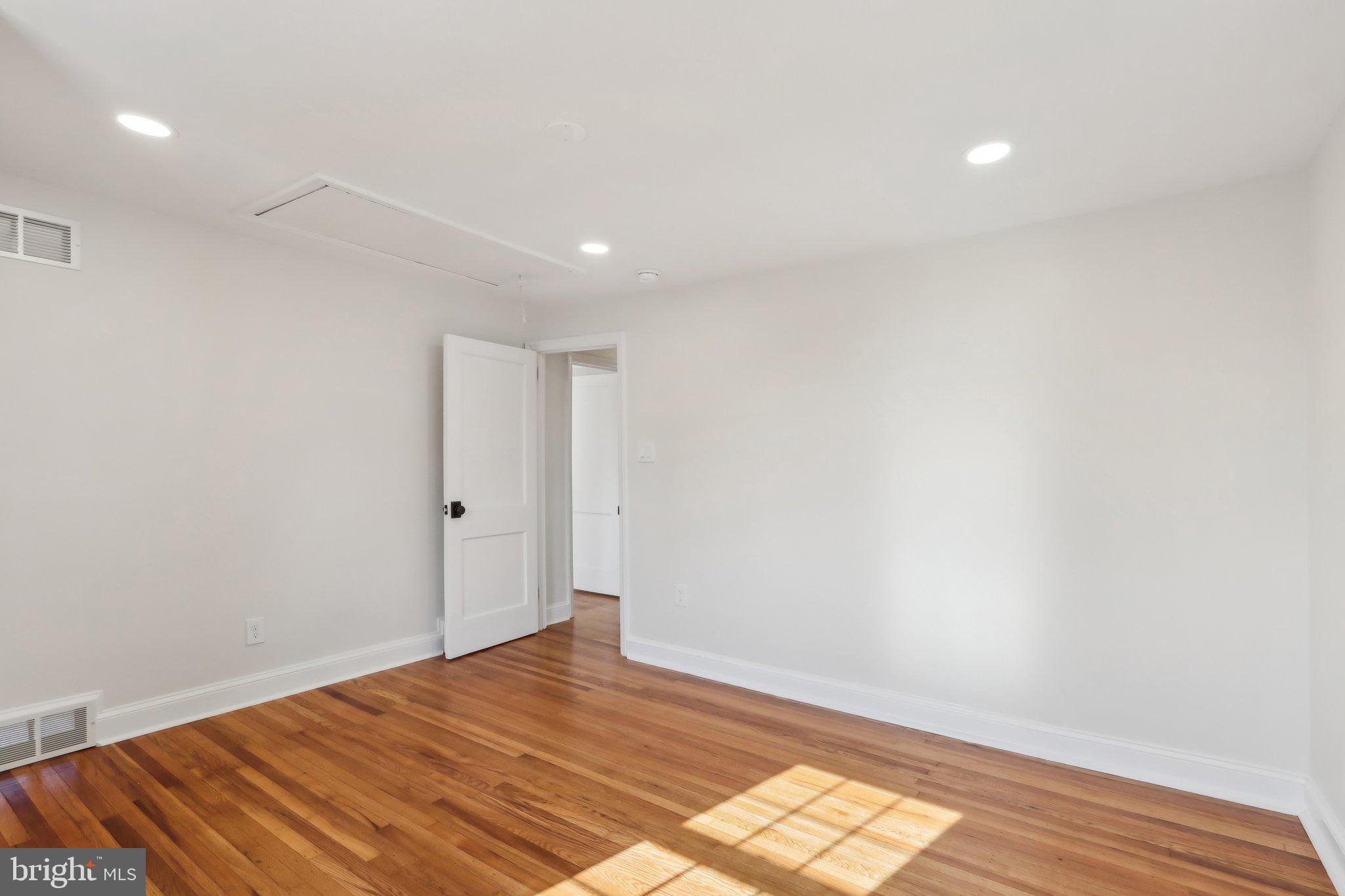 607 Fairview Road Swarthmore, PA 19081 - Photo 49 of 63 a view of empty room with wooden floor