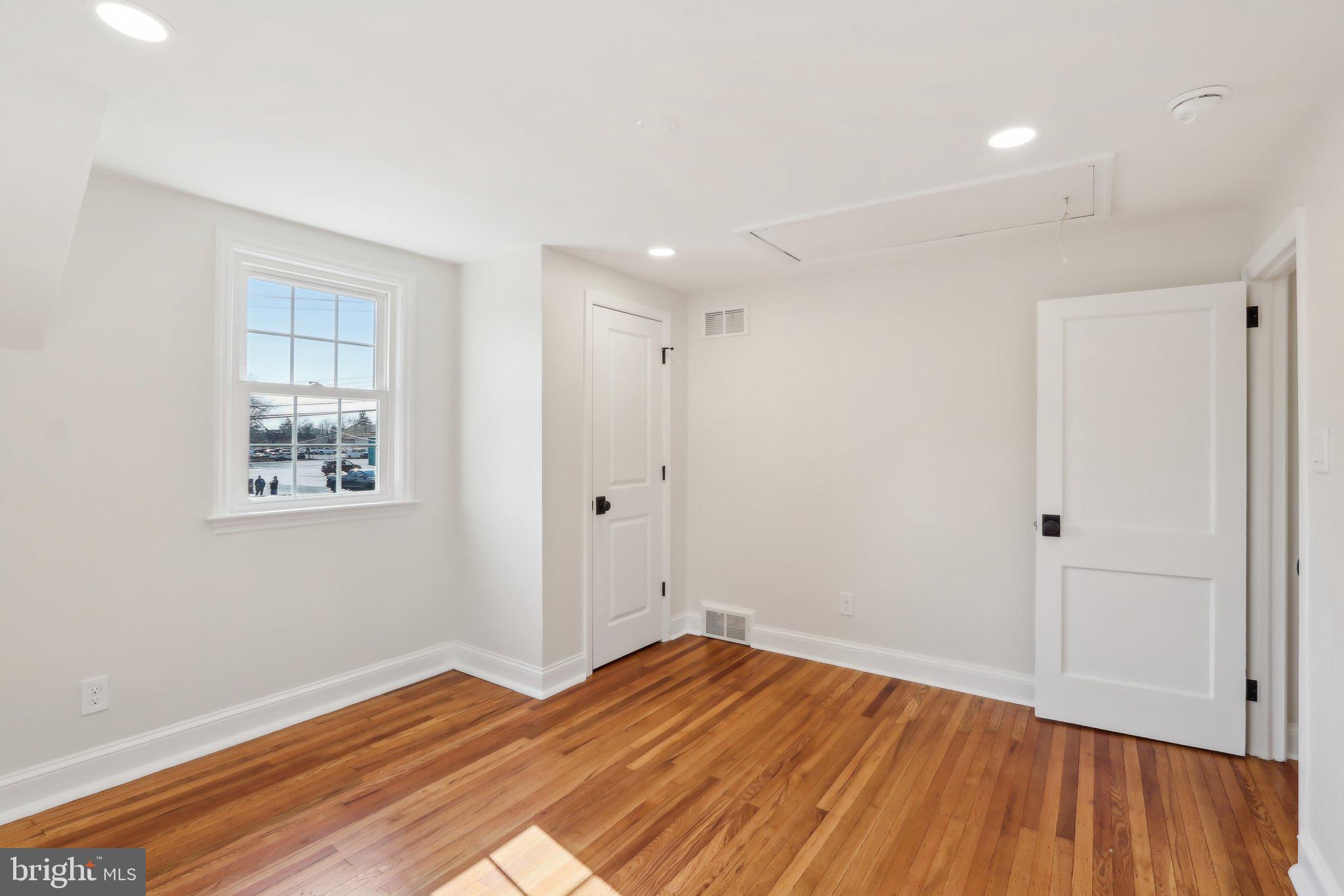 607 Fairview Road Swarthmore, PA 19081 - Photo 50 of 63 a view of empty room with wooden floor and fan