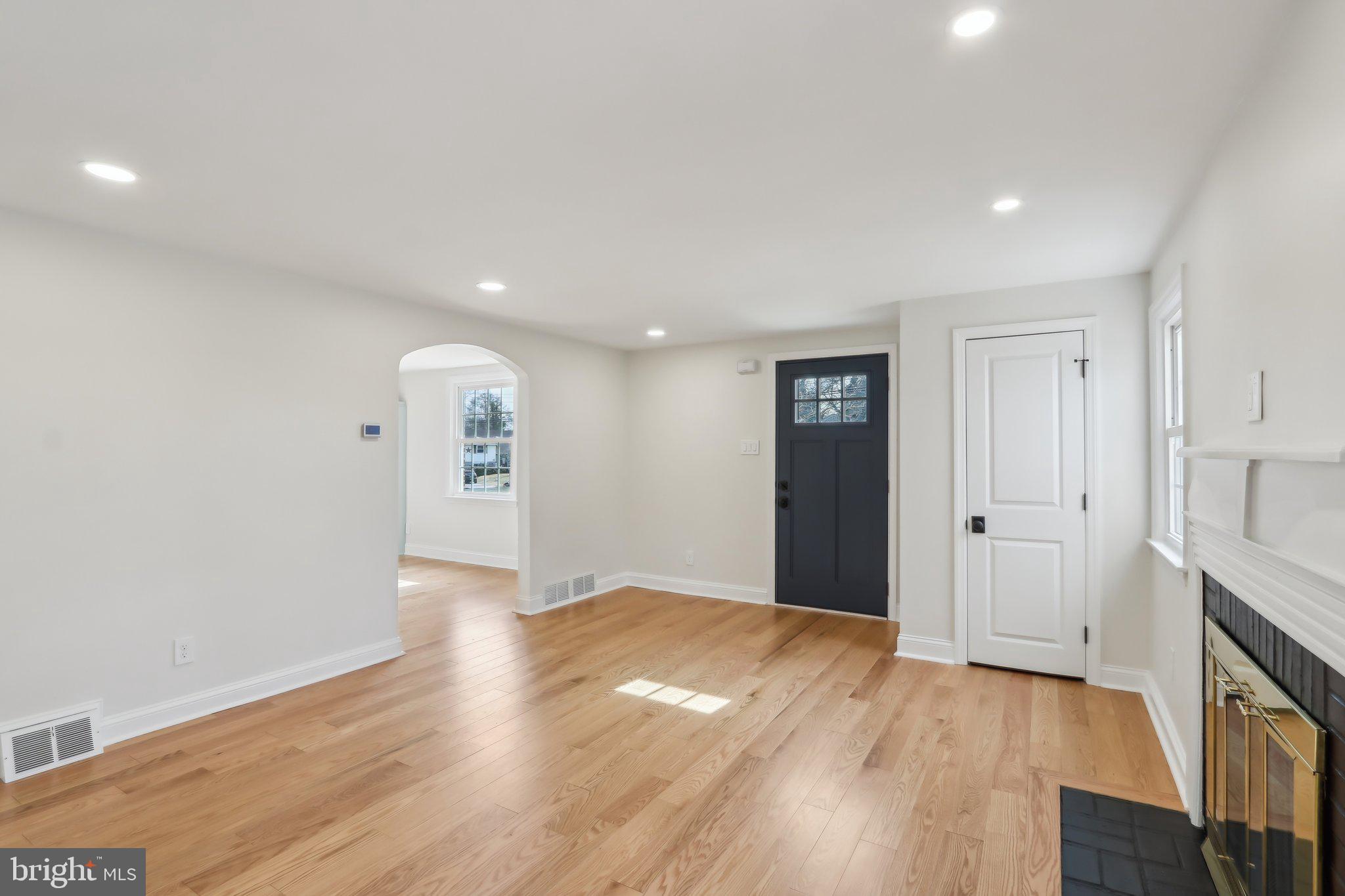 607 Fairview Road Swarthmore, PA 19081 - Photo 6 of 63 a view of an empty room with wooden floor and a window