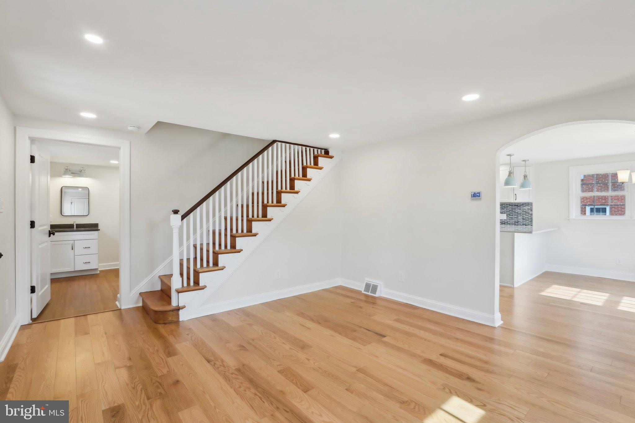607 Fairview Road Swarthmore, PA 19081 - Photo 9 of 63 a view of a hallway with wooden floor and staircase