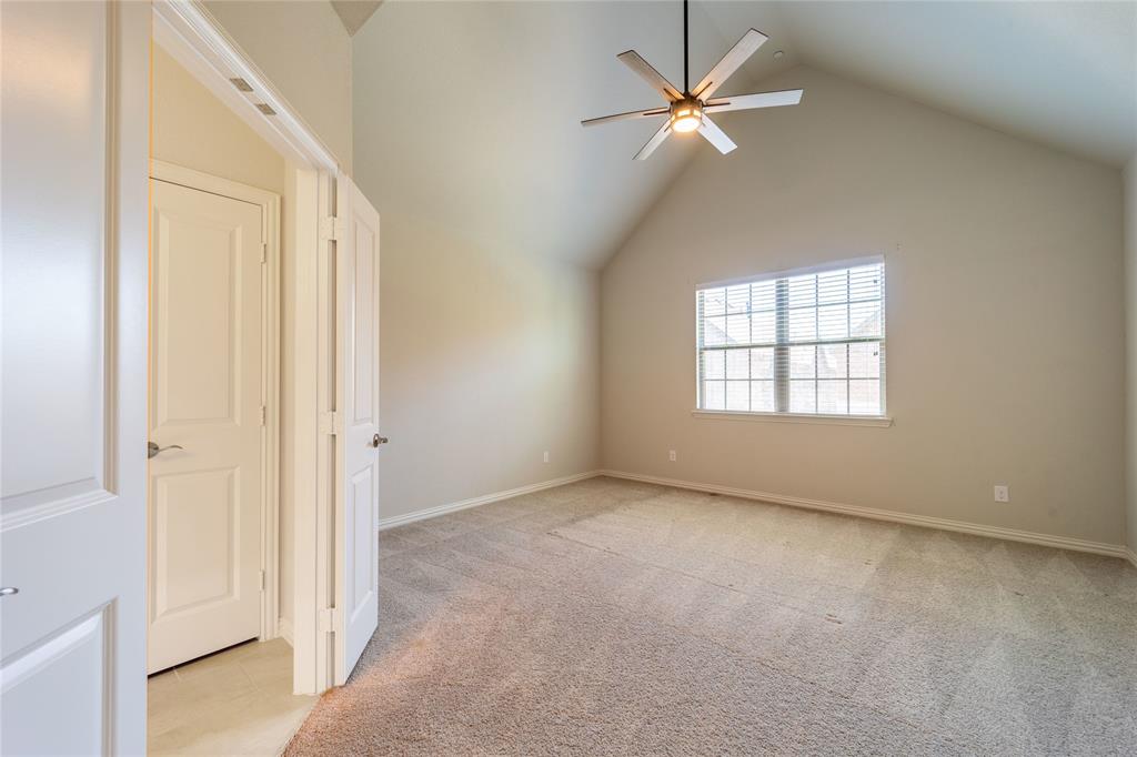 4666 Rhett Lane, Unit E Carrollton, TX 75010 - Photo 19 of 40 Primary suite has cathedral ceiling