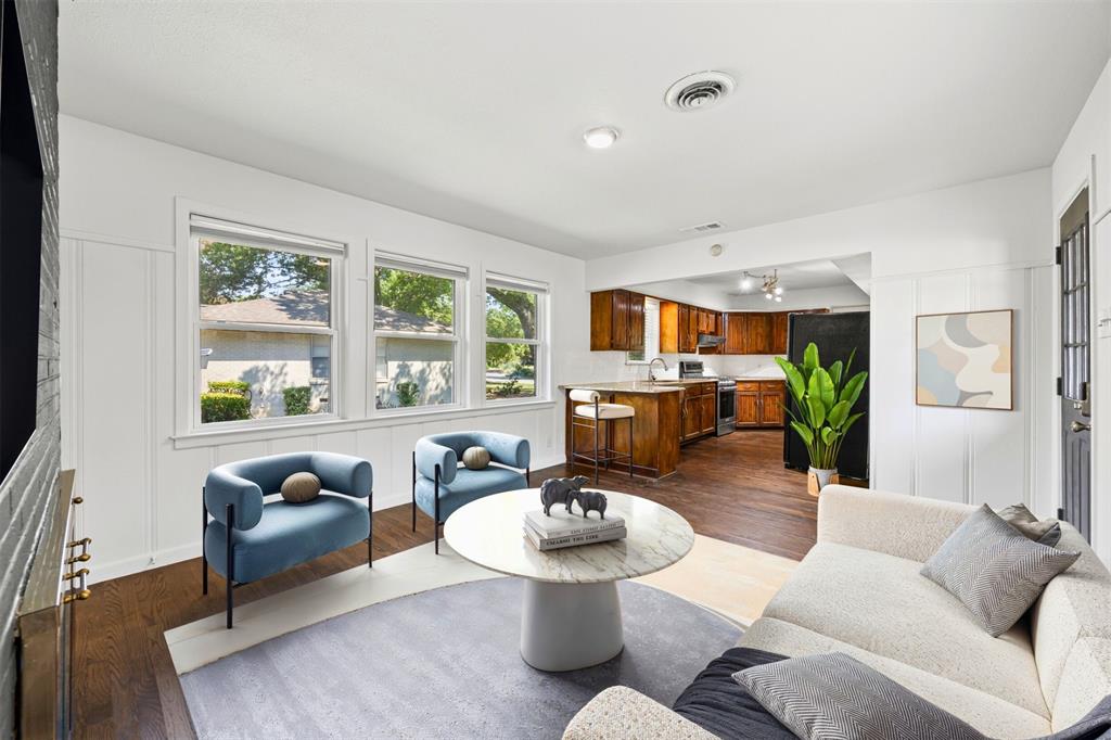 1630 Loree Drive Dallas, TX 75228 - Photo 8 of 20 a living room with furniture and floor to ceiling windows