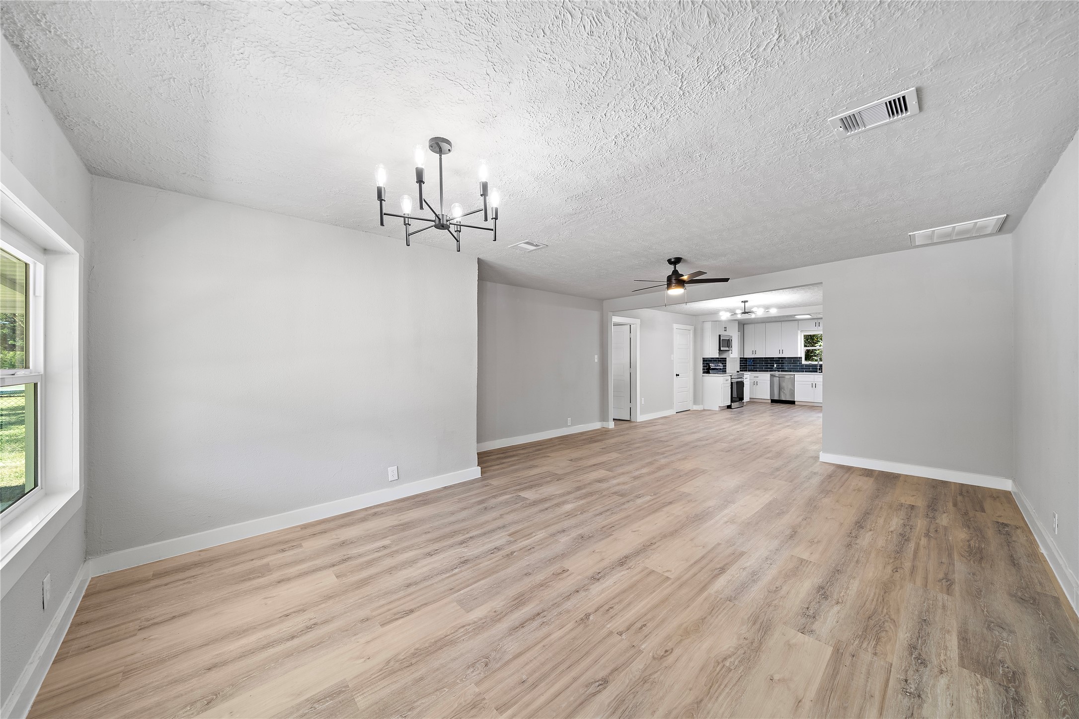 1004 West Harris Avenue Pasadena, TX 77506 - Photo 2 of 16 a view of empty room with wooden floor