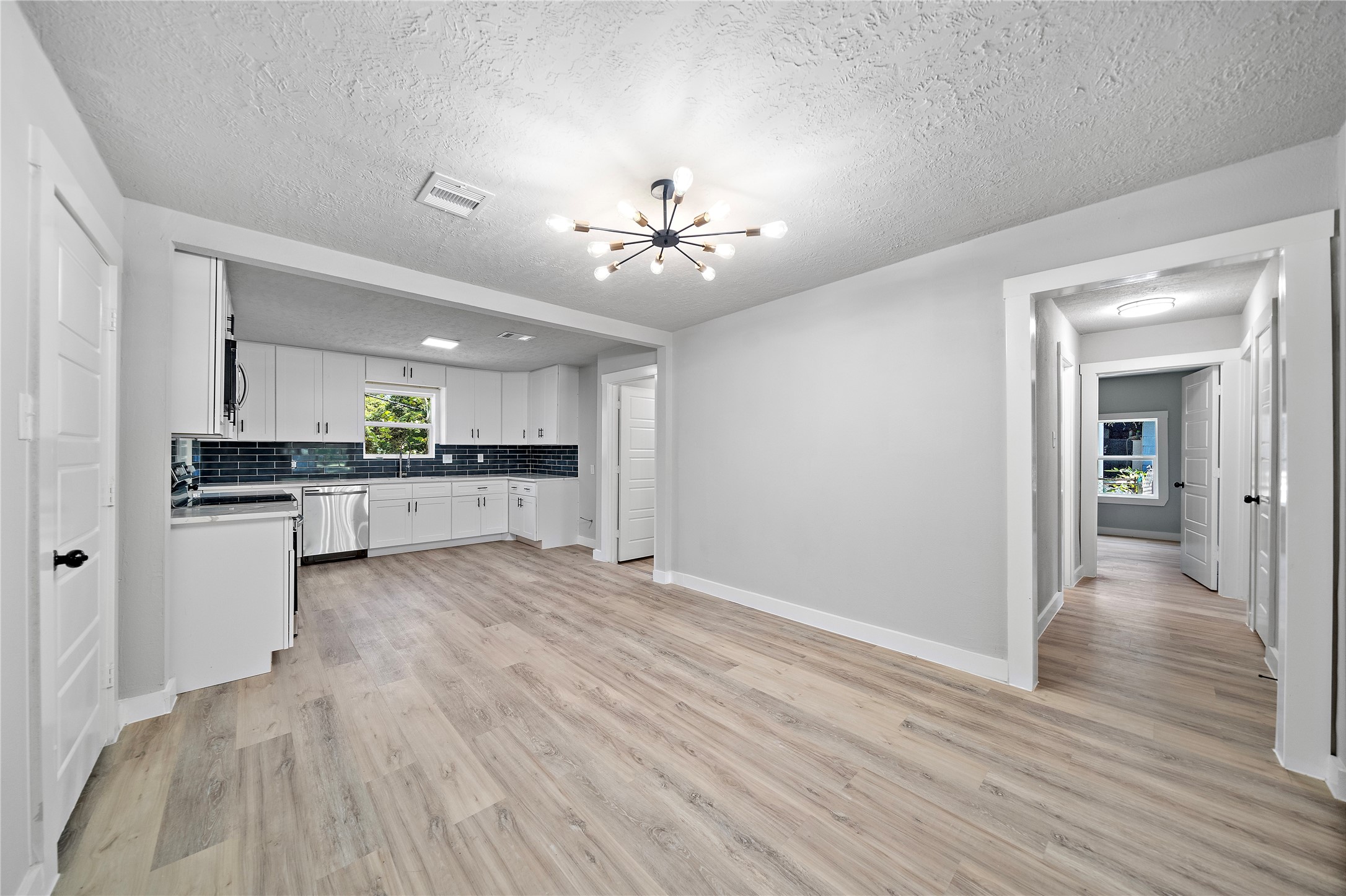 1004 West Harris Avenue Pasadena, TX 77506 - Photo 5 of 16 a view of kitchen with granite countertop cabinets and wooden floor