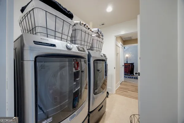 a view of a hallway with a chandelier