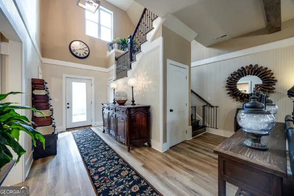 a view of entryway with wooden floor