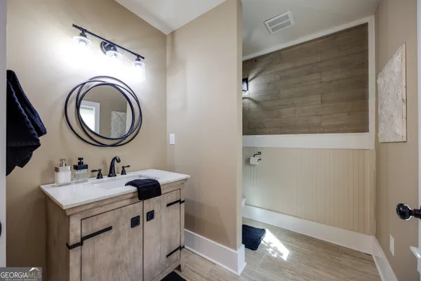 a bathroom with a sink and a mirror