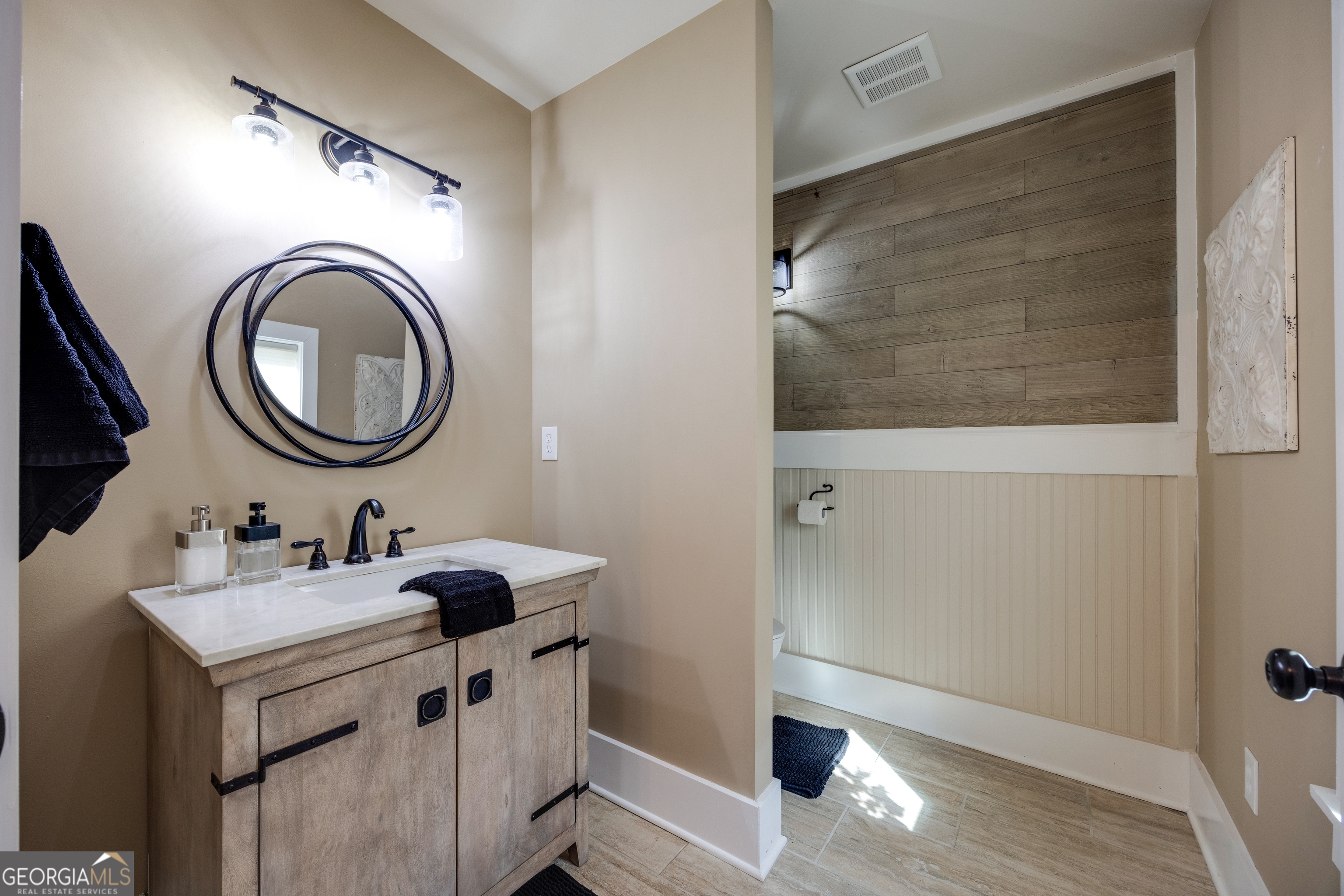 65 Eagle Bluff Road Menlo, GA 30731 - Photo 22 of 42 a bathroom with a sink and a mirror
