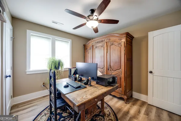 a workspace with furniture and a window
