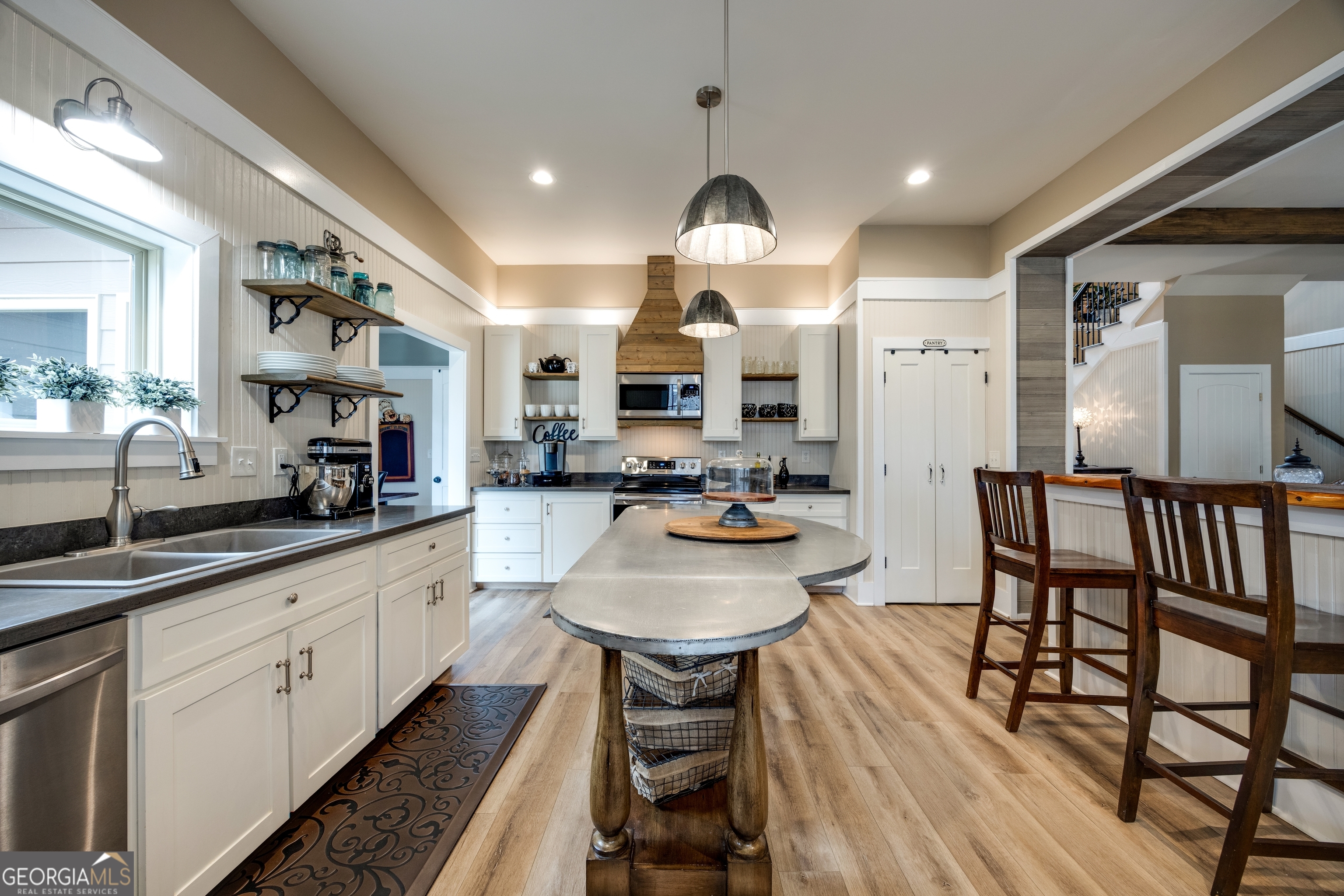 65 Eagle Bluff Road Menlo, GA 30731 - Photo 5 of 42 a large kitchen with stainless steel appliances kitchen island granite countertop a sink and cabinets