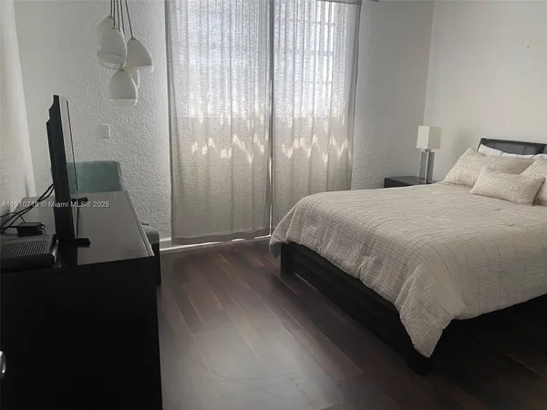 a kitchen with stainless steel appliances a refrigerator sink and cabinets