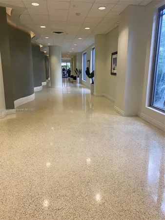 a view of a swimming pool with a yard