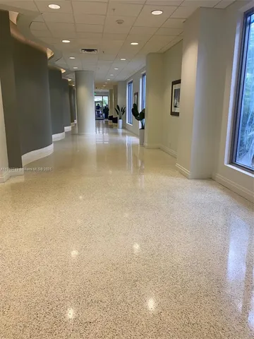 a view of a swimming pool with a yard