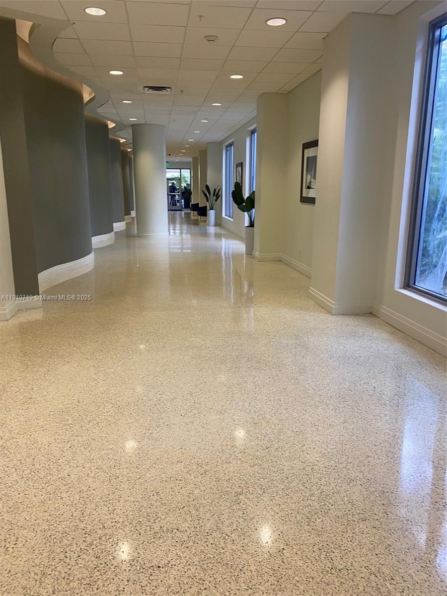 4001 South Ocean Drive, Unit 14F Hollywood, FL 33019 - Photo 2 of 16 a view of a livingroom with couch and kitchen view