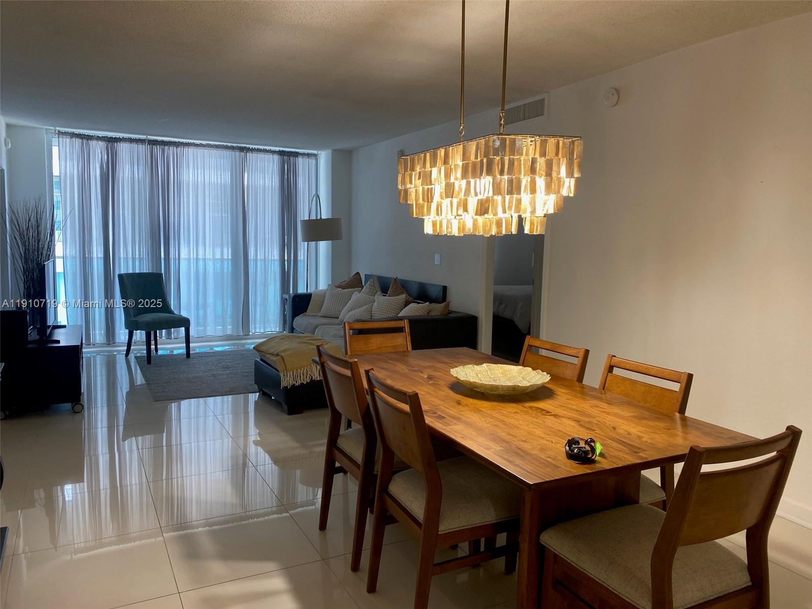 4001 South Ocean Drive, Unit 14F Hollywood, FL 33019 - Photo 4 of 16 a view of a dining room with furniture