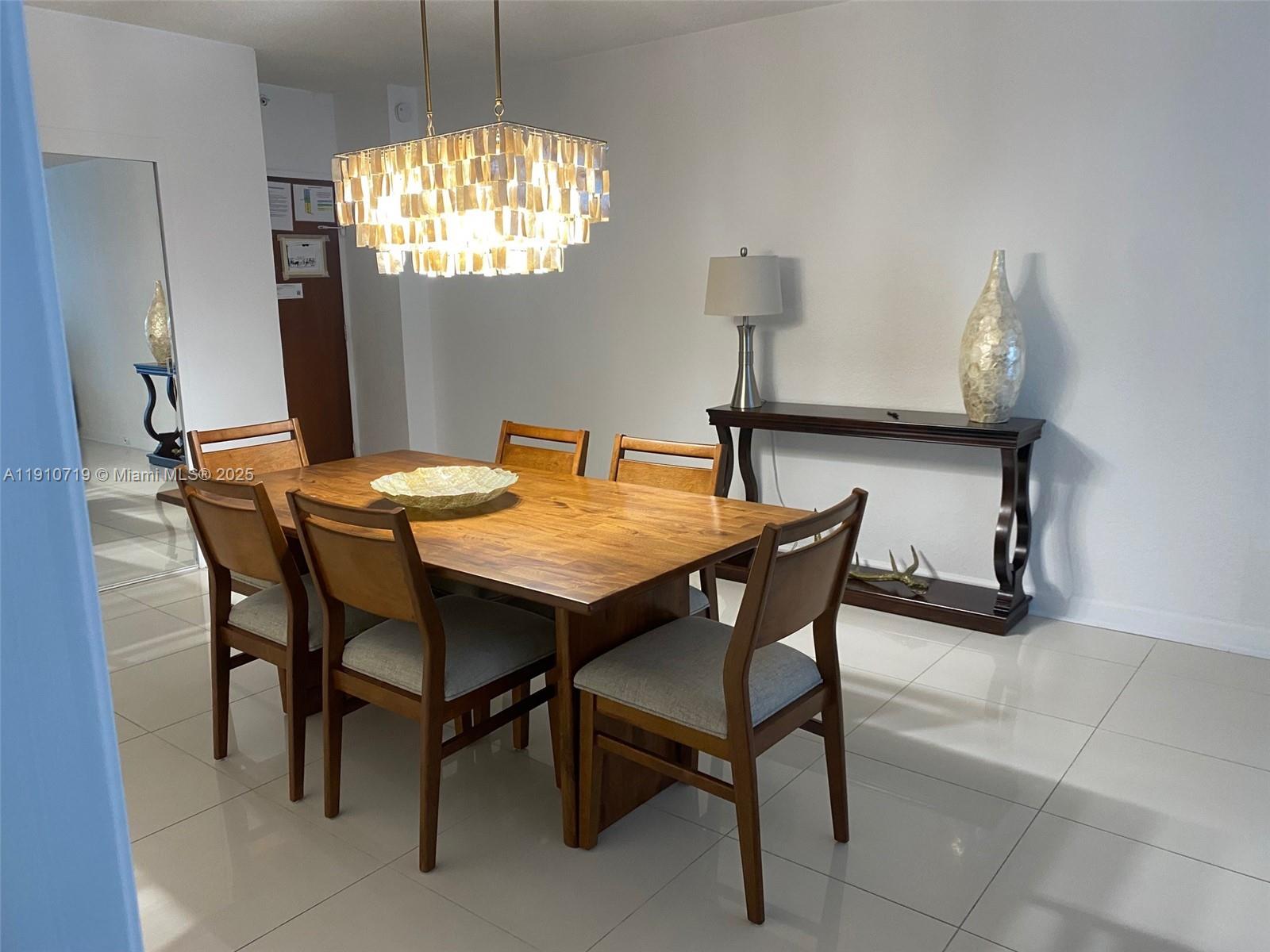 4001 South Ocean Drive, Unit 14F Hollywood, FL 33019 - Photo 10 of 16 a dining room with furniture and window