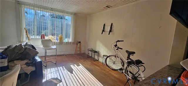 a view of a room with gym equipment and a window