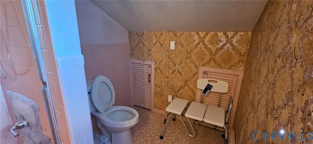 a bathroom with a toilet and a sink