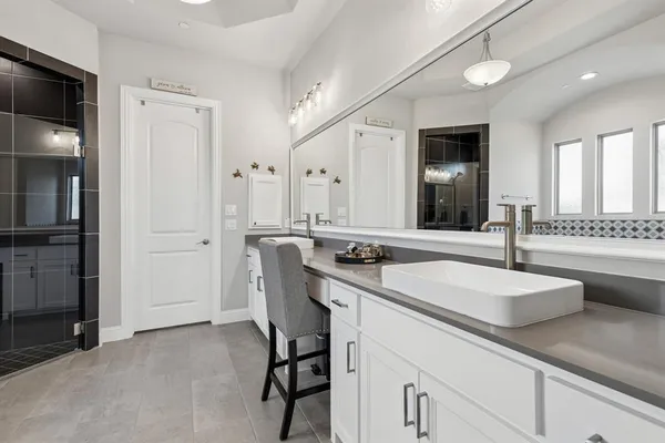 a bathroom with a tub and shower