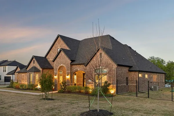 a front view of a house with a yard