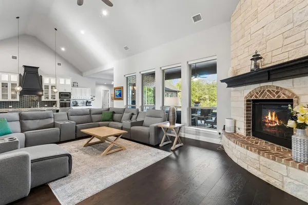 a living room with furniture fireplace and a fireplace