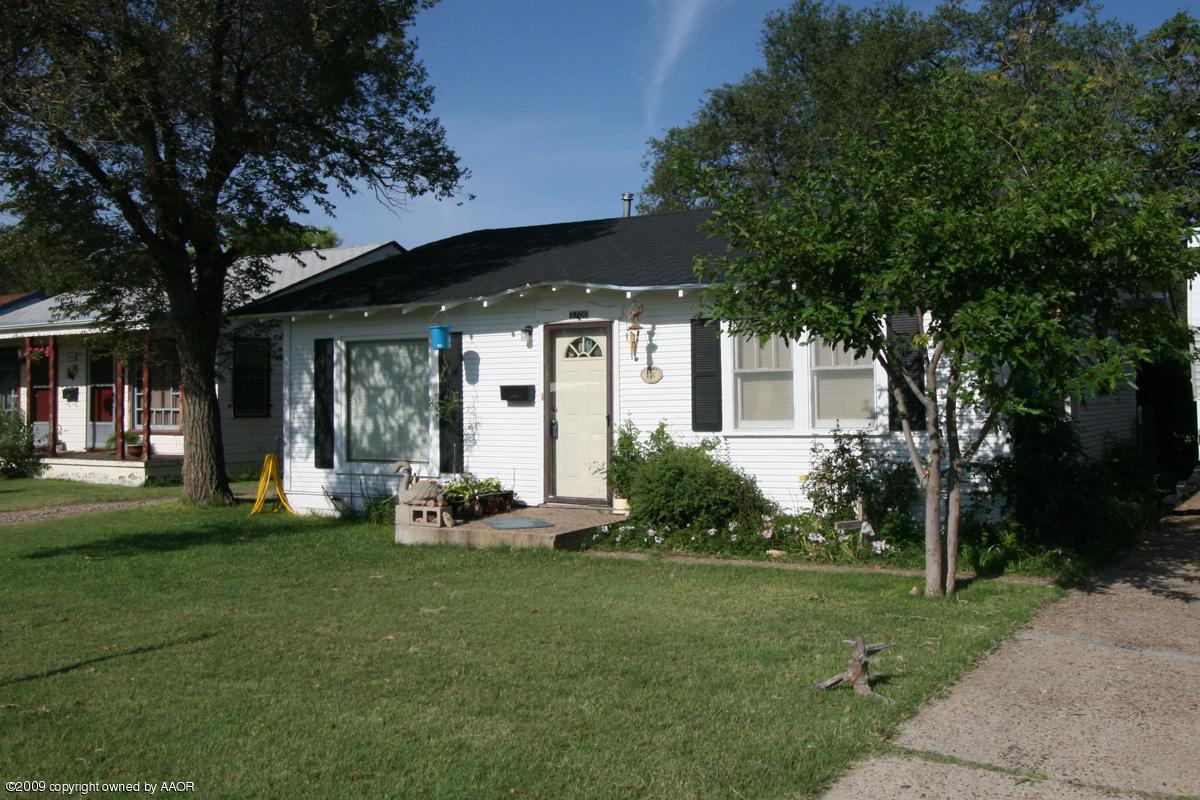 3700 South Harrison Street Amarillo, TX 79110 - Photo 11 of 14 a front view of a house with garden
