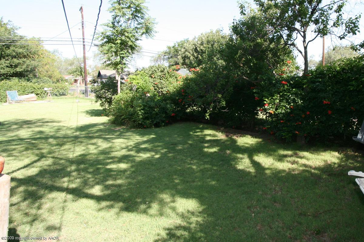 3700 South Harrison Street Amarillo, TX 79110 - Photo 2 of 14 a view of yard with green space and trees around
