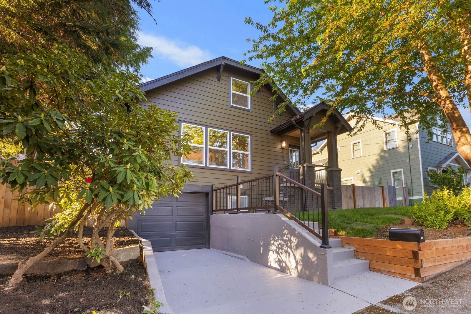 512 Northwest 44th Street Seattle, WA 98107 - Photo 2 of 37 a view of house with a yard