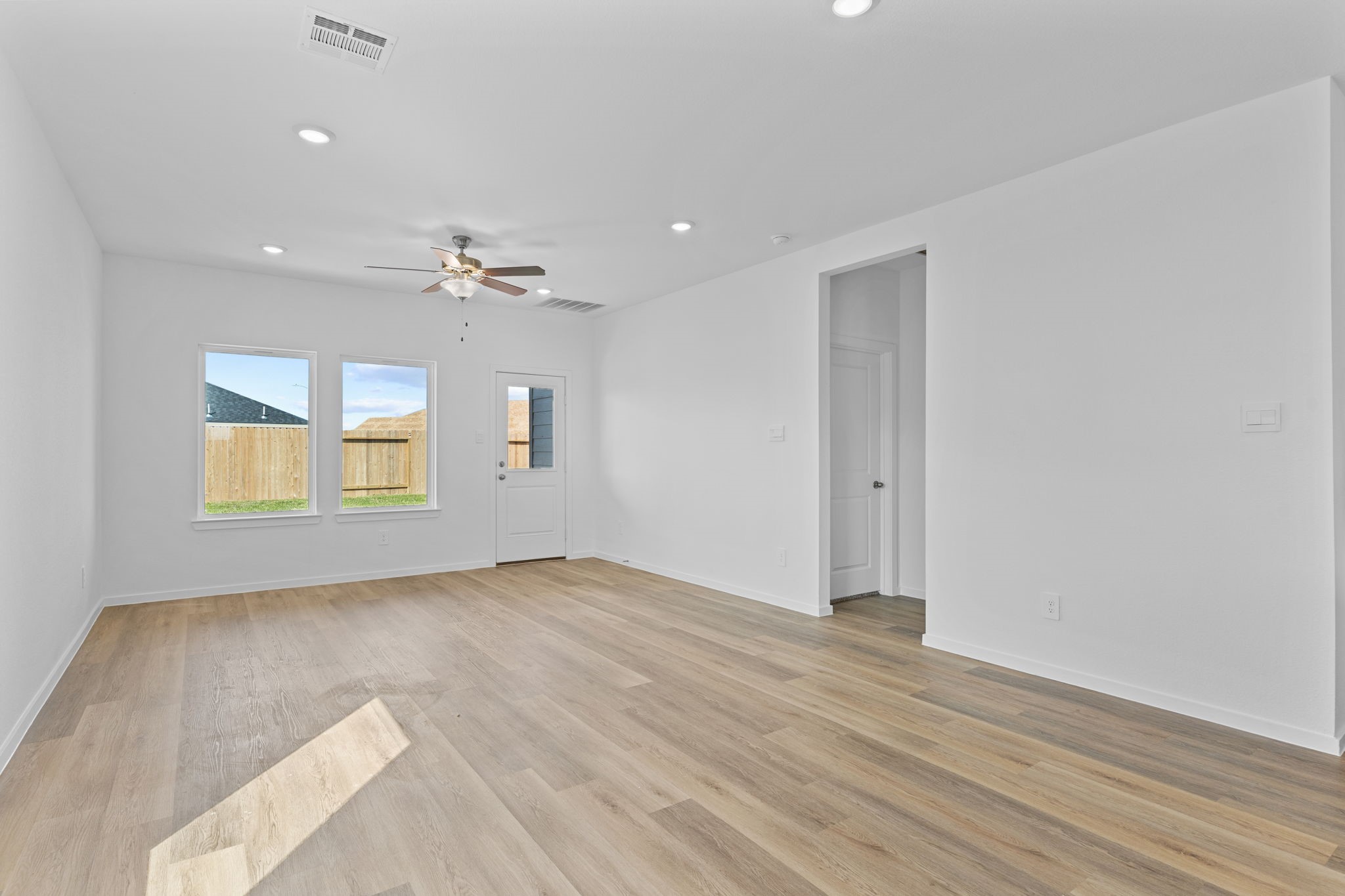9019 Rose Water Iowa Colony, TX 77583 - Photo 18 of 44 wooden floor in an empty room with a window