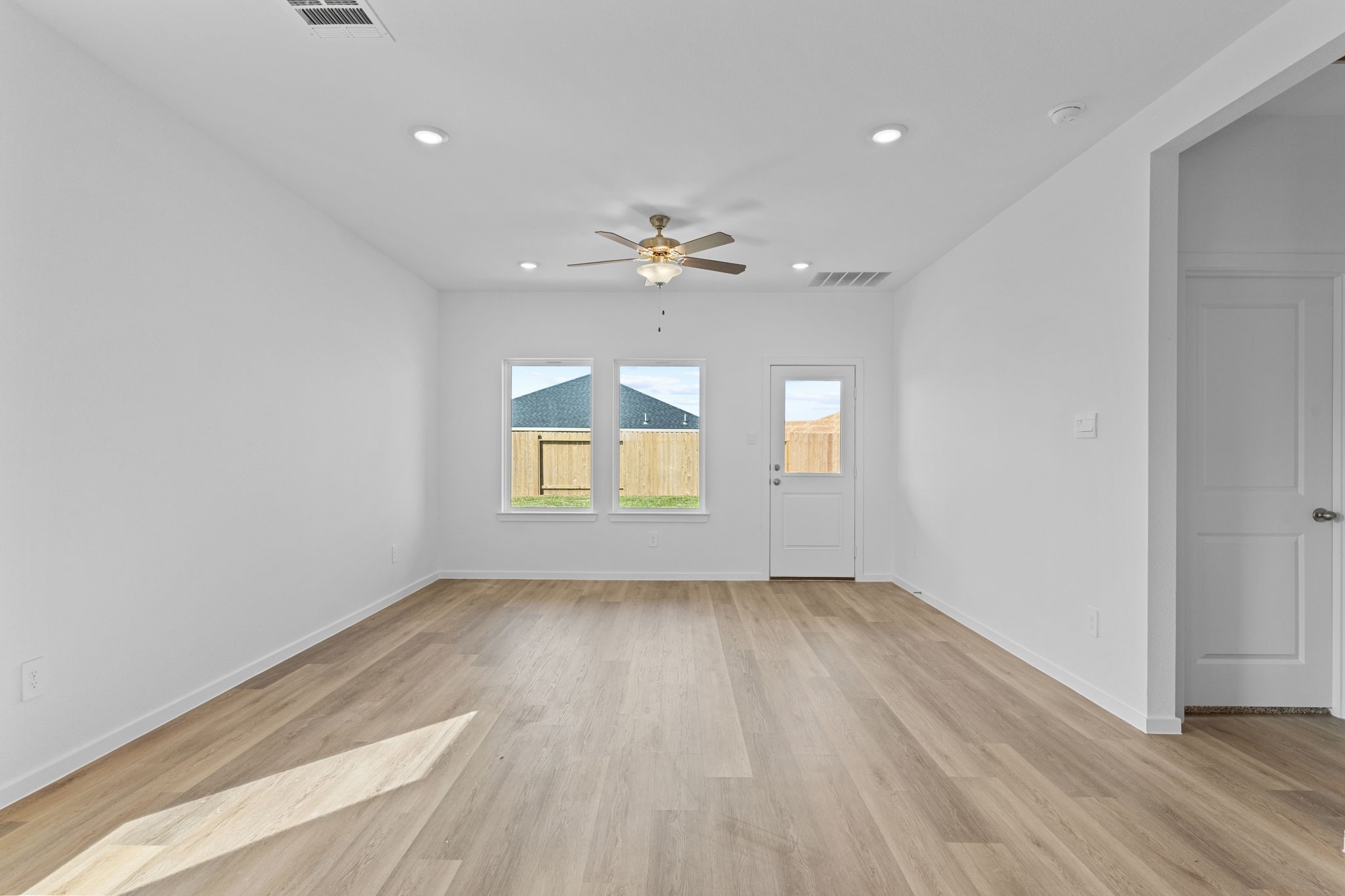 9019 Rose Water Iowa Colony, TX 77583 - Photo 19 of 44 wooden floor in an empty room with a window