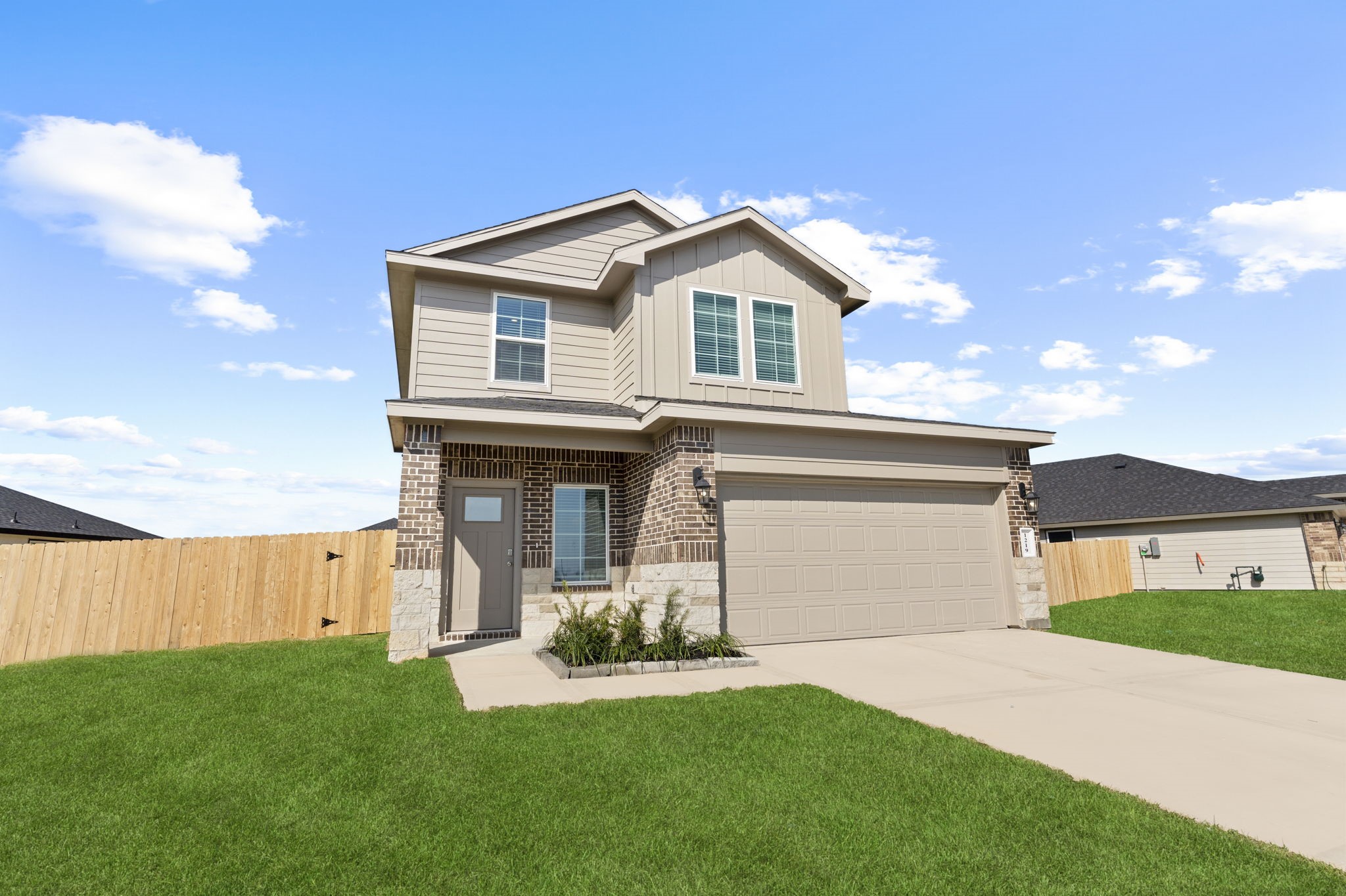 9019 Rose Water Iowa Colony, TX 77583 - Photo 3 of 44 a aerial view of a house with a yard and garage
