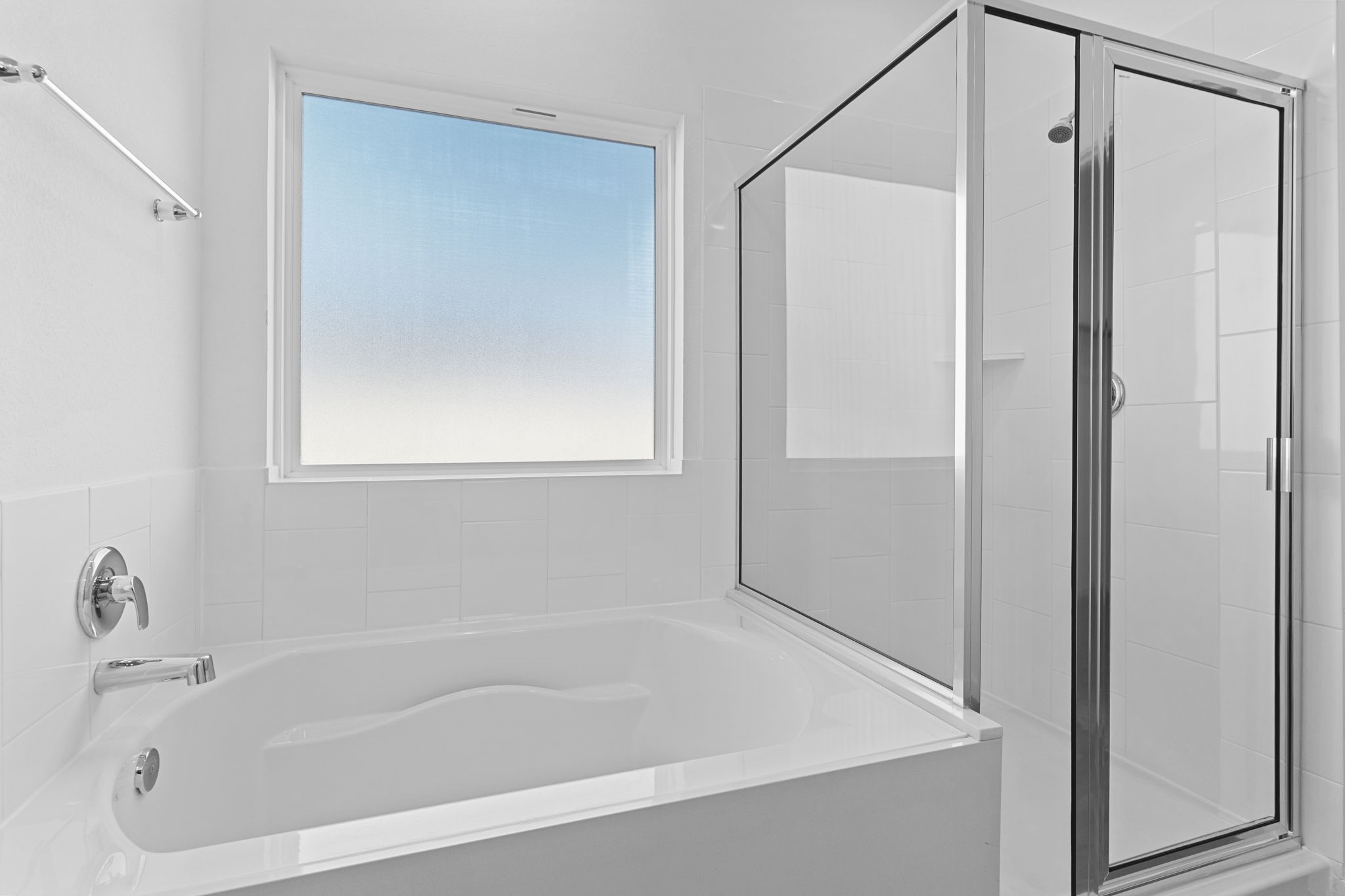 9019 Rose Water Iowa Colony, TX 77583 - Photo 31 of 44 a white bath tub with a shower