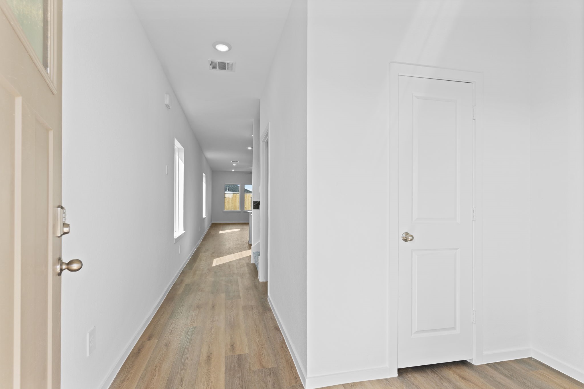 9019 Rose Water Iowa Colony, TX 77583 - Photo 5 of 44 a view of a hallway with wooden floor