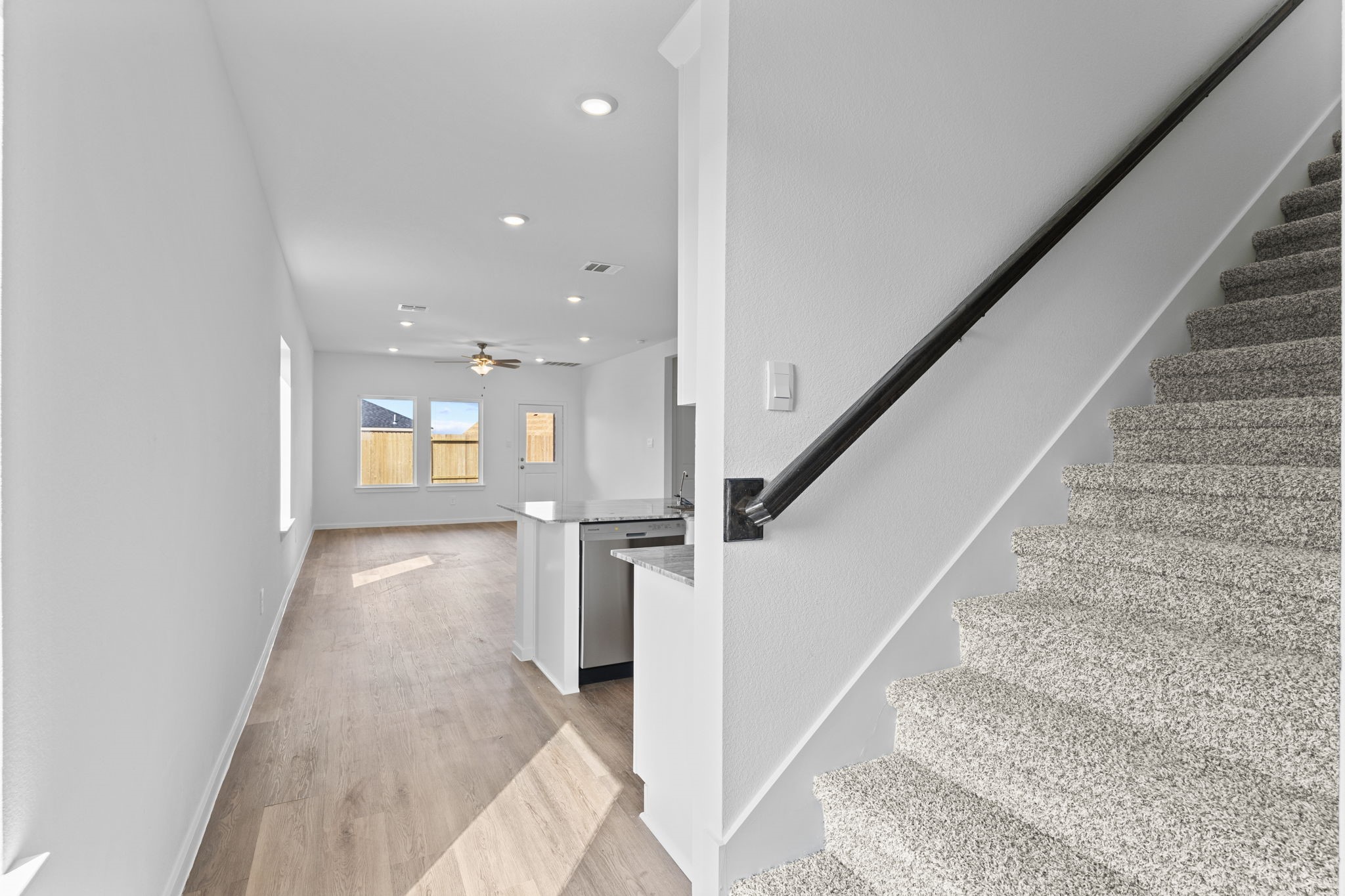 9019 Rose Water Iowa Colony, TX 77583 - Photo 7 of 44 a view of entryway and hall with wooden floor