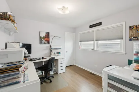 a workspace with furniture and wooden floor