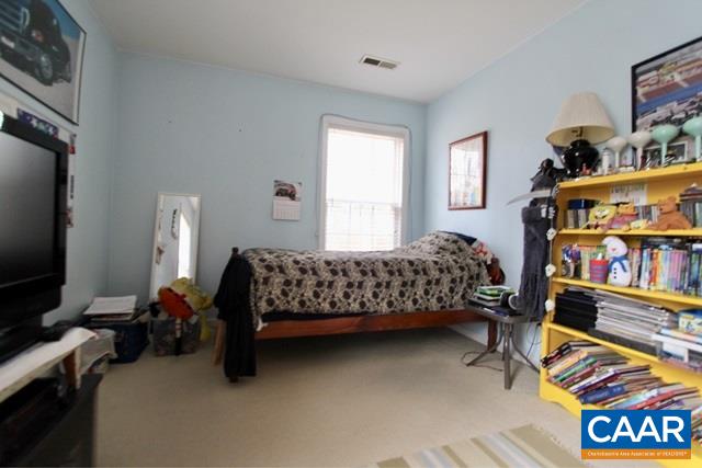 82 Northridge Road Ruckersville, VA 22968 - Photo 14 of 23 a bedroom with bed and a bookshelf