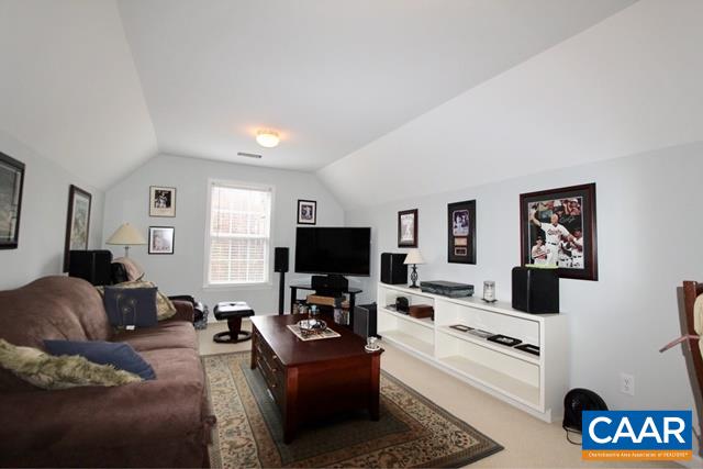 82 Northridge Road Ruckersville, VA 22968 - Photo 19 of 23 a living room with furniture and a flat screen tv