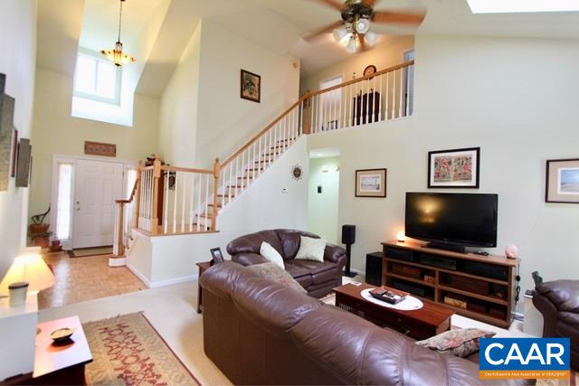 82 Northridge Road Ruckersville, VA 22968 - Photo 3 of 23 a living room with furniture and a flat screen tv