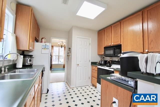 82 Northridge Road Ruckersville, VA 22968 - Photo 7 of 23 a kitchen with stainless steel appliances granite countertop a refrigerator and a stove top oven
