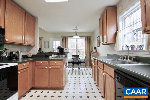 82 Northridge Road Ruckersville, VA 22968 - Photo 8 of 23 a kitchen with stainless steel appliances a sink a stove a refrigerator and cabinets