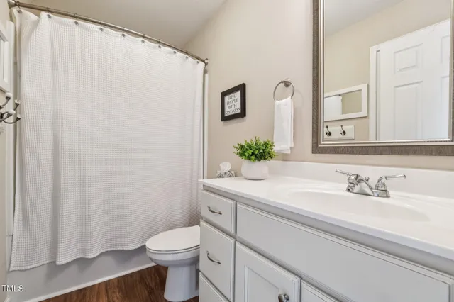 a room with lots of books and furniture