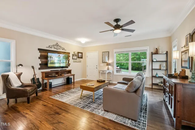 a view of a patio with table and chairs and potted plants