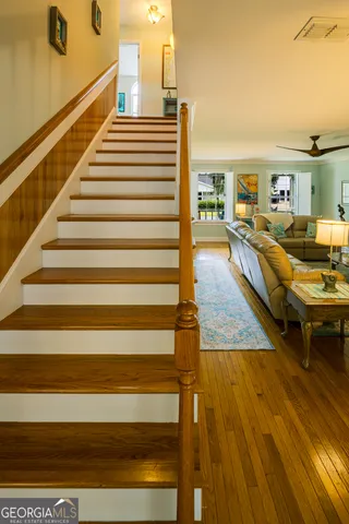 a front view of a house with garden and sitting area