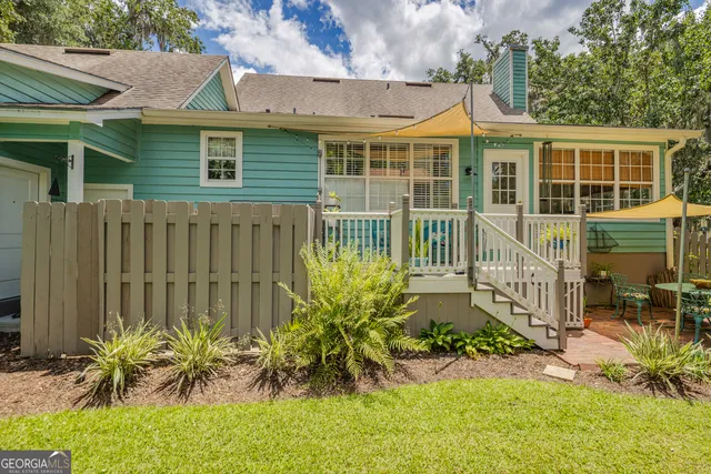 a bed room with a bed and a chandelier