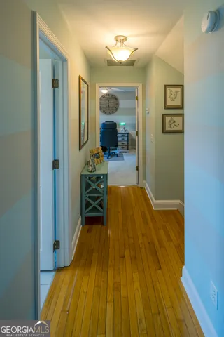 a view of a house with a yard patio and a garden