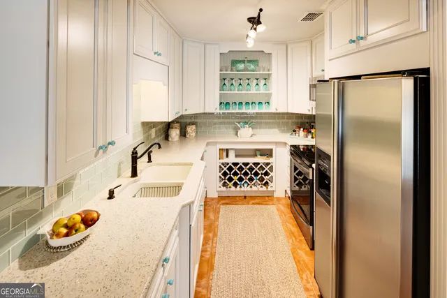 a living room with patio a couch and a potted plant
